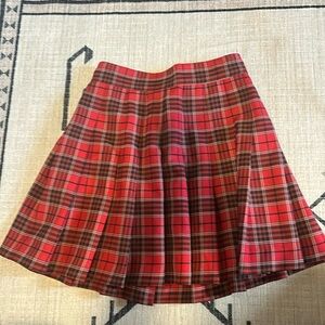 Red pleated skirt. High waisted.